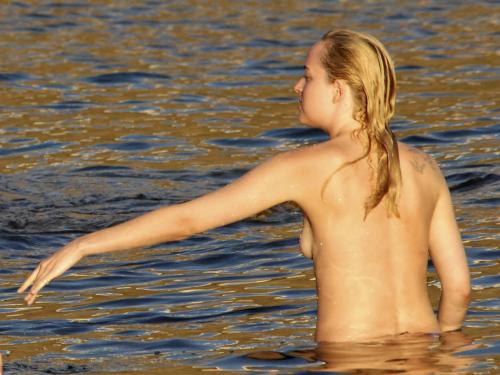 toplessbeachcelebs:Dakota JohnsonÂ swimming topless in Pantelleria, ItalyÂ (October 2014)