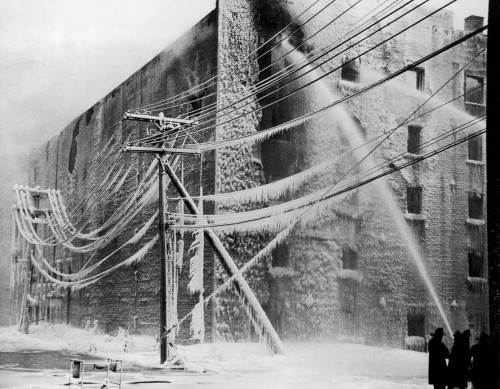 luzfosca:  Firefighters battle a blaze in Albany, New York. 1940. From Historical