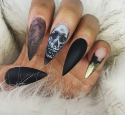 sixpenceee:Halloween themed nails from here. Be sure to follow