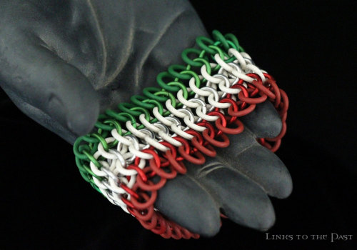 links-to-the-past:  Have you seen our handmade chainmail cuffs designed after country flags? Each cuff is made using anodized aluminum and latex-free rubber, and is stretchy with no clasp. Currently, we have cuffs featuring the colors of the the American