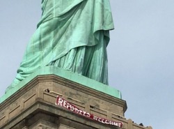 gogomrbrown:  A giant ‘Refugees Welcome’ sign was unfurled