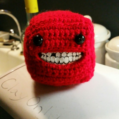 littleprinceprotea:  It’s everyone’s favorite cube of flesh, Super Meat Boy! Body is crochet, teeth are hand sculpted, painted, and then sewn in.