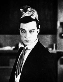 semioticapocalypse:  Buster Keaton with a kitten on his head.