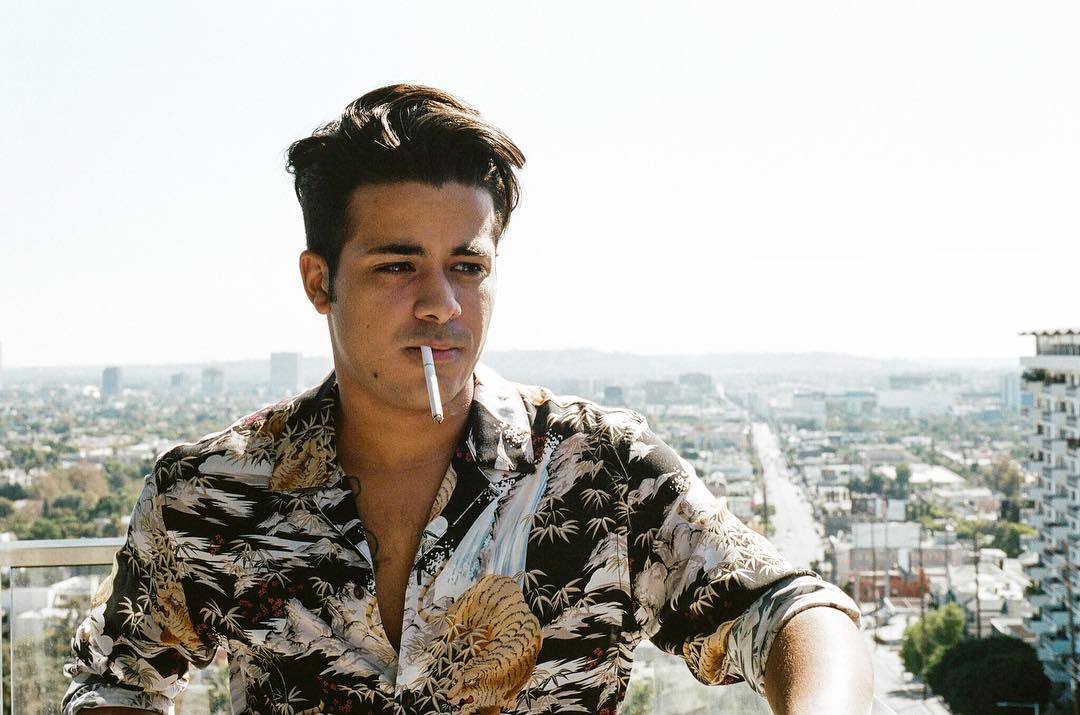 Christian Navarro smoking a cigarette (or weed)
