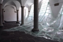  Aerial | Baptise Debombourg. Shattering glass flooding into