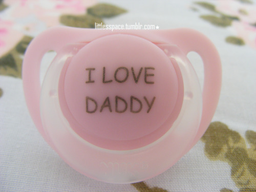 littlesspace:  I love my pink shirt. And my I LOVE DADDY paci. And my rainbow-heart necklace, that I prefer wearing as a bracelet, so I can see it, hehehe. (Diaper: Tena FeelDry Slip Plus, Size L) 