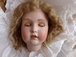 hazedolly:  Antique bisque doll head with fur eyebrows and mohair