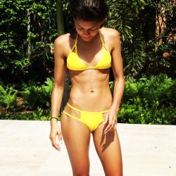 coolnessman24:Wicked fit and toned Zendaya in yellow bikini.