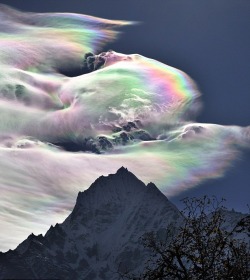 Chasing a dream (iridescent cloud over Thamseku Mountain in the Himalayas)