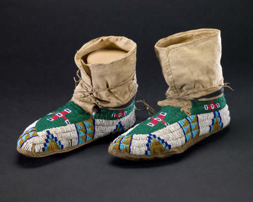 blondebrainpower:Pair of moccasins with glass bead decorations. United