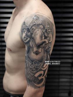 tattoofilter:  Black and grey style Ganesha tattoo on the left