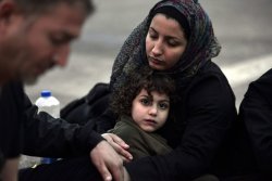 letswakeupworld:  A Syrian mother tries to warm up her daughter