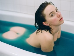 creativerehab:  Kacie in the blue bath. Lo-res 120 film scan.