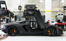 topvehicles:  Matte black Aventador in one hell of a shop