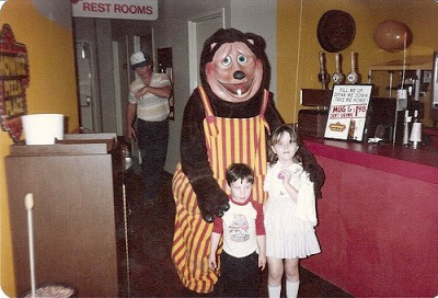 skeletonsiro:  With how spooky Weekend at Freddy’s is, I hope people are going back and looking at real life scary food mascots like the Showbiz Pizza Bear.  For extra creepiness, the kid’s shirt says “DICK THE BIRTHDAY BOY”  o.O