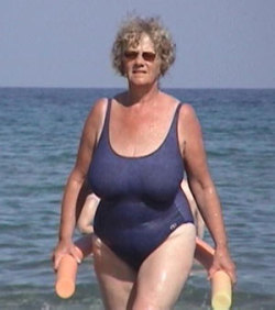 This curvy sexy old beach granny is sporting nice big firm breasts and a generous bottom. Everything a horny young stud dreams about!