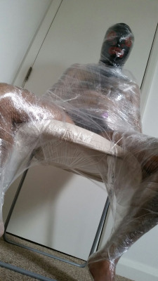 Slave Qwerty has an encasement fetish, so I wrapped him up in some cling film, and teased his cock with a vibrator. London, April 2015.