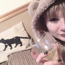 Home alone,drinking wine dressed like a bear 