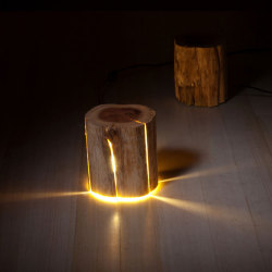 asylum-art-2:    Blind Artist Makes Cracked Log Lamps Bursting