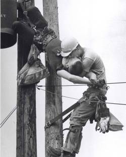 historicaltimes:“The Kiss of Life”: A utility worker,