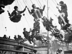  On the swing ride at the Hampstead Heath Fair, England, March