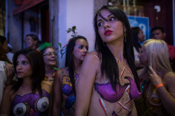 Topless and body painted at a Brazilian carnival, by sicilia