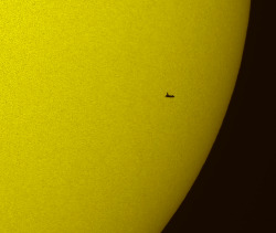 humanoidhistory:  The Space Shuttle Atlantis seen in silhouette