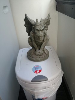 copperbadge:  hidingunderchairs:  teafortteu:  not-a-single-fuck:  teafortteu:  My garbage can lid won’t close, so I now my gargoyle is now Keeper of the Trash   You must answer the riddle of the gatekeeper.  I can’t believe my Keeper of the Trash