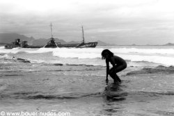 silhouette in front of stranded ship, Madagascar. By Daniel Bauer