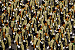 unrar:  Soldiers march in a National Day parade in Kuala Lumpur,