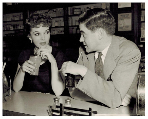 PORTRAIT OF A STRIPPER Vintage press photo dated from September of ‘53, features dancer Marcia Edgington having a soda with a friend.. The accompanying press article mentions that she enjoys the independence a stripping career affords her.. And