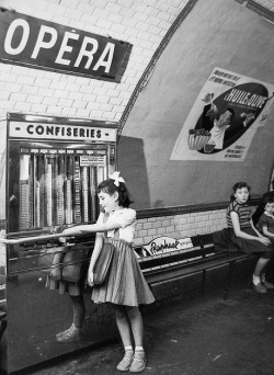 theniftyfifties:  A girl buys sweets in a Metro station, Paris,