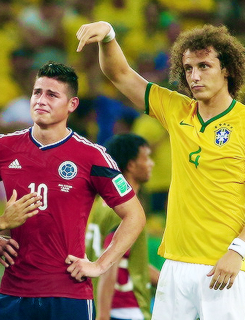  The World Cup /  David Luiz of Brazil consoles James Rodriguez