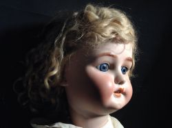 hazedolly: Antique bisque doll emerging from darkness Photo credit: