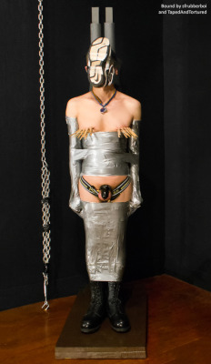 tapedandtortured:Lockypup, taped the the stake.