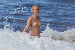 toplessbeachcelebs:  Miley Cyrus (Singer) swimming topless in