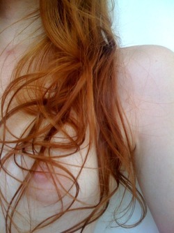 Close up shot of a beautiful redheads’ nipple.