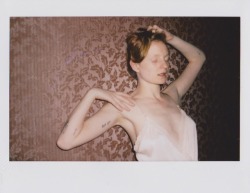 coconutdreamin: Ignoring the rest of the world   Instax 210 shot