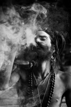 nepal:Sadhu smoking a chillum- Pashupatinath. Nepal