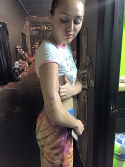 Miley got a tattoo at my friends shop in OKC with Wayne from