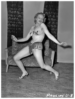 Paula Uhsan         ..shakes it up!From a 50’s-era photo series shot by Irving Klaw..