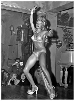 Lilly “The Cat Girl” Christine performs her routine on stage at ‘Prima’s 500 Club’ in New Orleans, sometime during the mid-1950’s..  Check out the claws on her fingers!