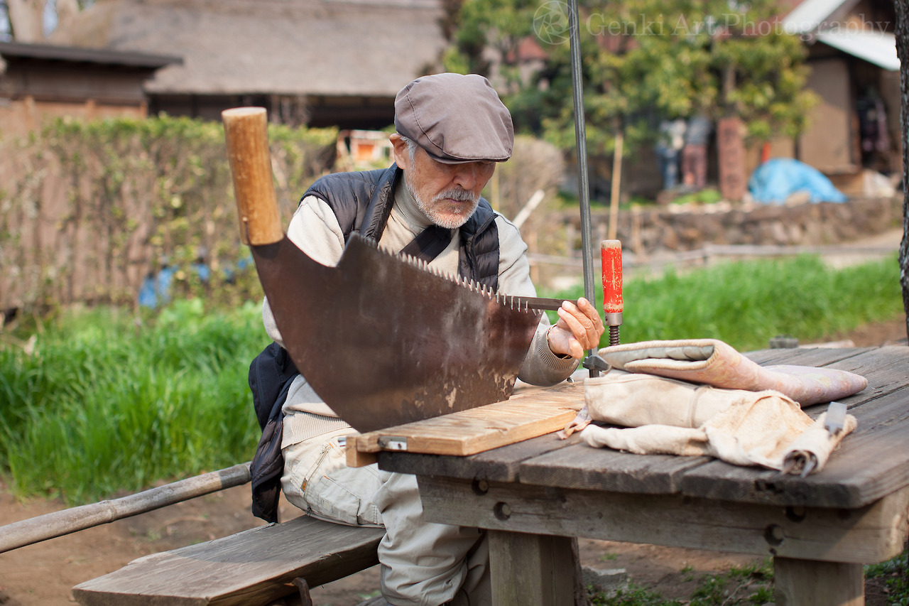 <p>Craftsman sharpening an old style Japanese board ripping saw, popular in the Edo period, at Jidayubori Minkaen in Setagaya, Japan.</p>