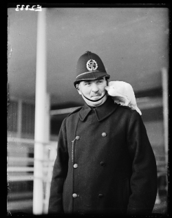 weirdvintage:  Policeman with a cockatoo on his shoulder.  The