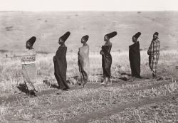 Six wives of Mseuteu Zulu with blankets around their bodies looking