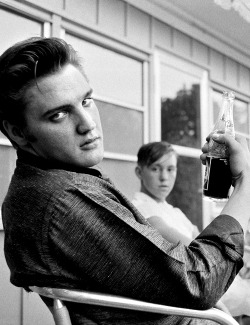 sophialorens:  Elvis Presley sitting on the porch of his home