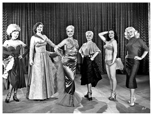    Gilda     (aka. Shirley Jean Rickert Measures) A publicity still from the 1953 Burlesque film: “The A-B-C’s Of Love”, features Gilda standing at center stage.. Blaza Glory (at Left) and Mae Blondell (at Right), are 2 of the dancers