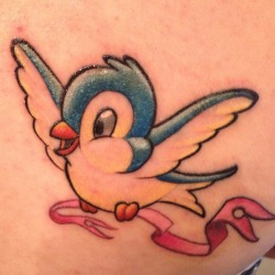 fuckyeahtattoos:  Blue and yellow snow-white style bird, carrying