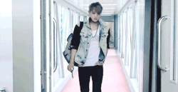 :  huang zitao on a catwalk getting off an airplane 