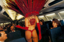 girl-cult-ure:A showgirl models fashions on an airplaneLas Vegas,